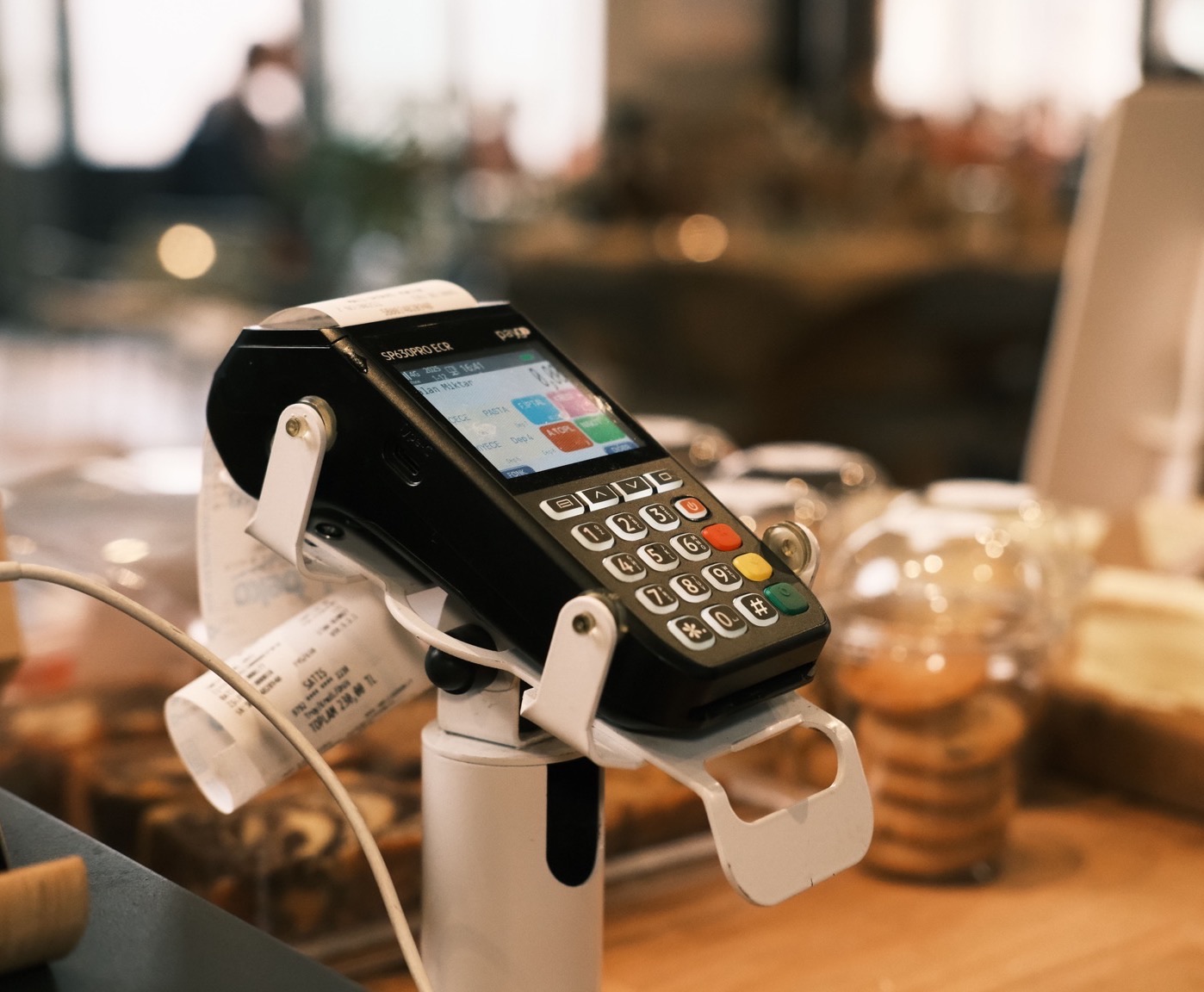 A payment terminal on a café counter